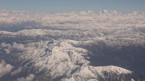 Scenic aerial flight over the worlds largest mountains, the Himalayas with views of Mount Everest an