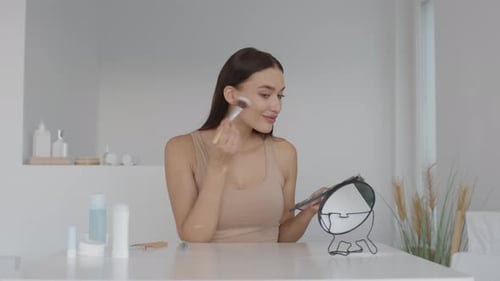 Woman Applying Makeup in a Bright and Modern Space During the Daytime