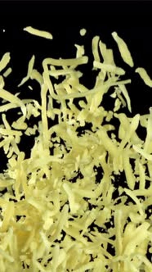 The Grated Cheese Flies Up and Down Filmed on a Highspeed Camera at 1000 Fps