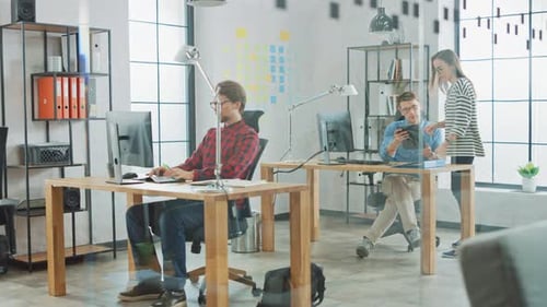 Young Professionals Working in Creative Agency in Loft Ofice. Female Colleague Comes to Chat to Cow