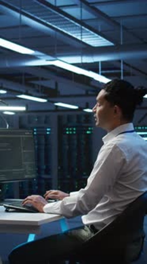 Vertical Video Developer and Coworker Overseeing Data Center