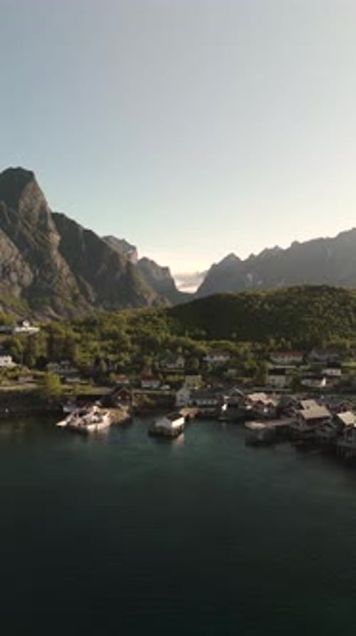 Stunning Aerial View of a Tranquil Village in Norway Surrounded By Majestic Mountains