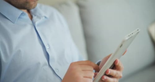 CloseUp on Businessman Using Digital Tablet