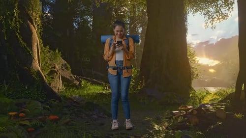 Full Body Of Asian Female Hiker Enjoy Using Smartphone While Exploring Forest Nature