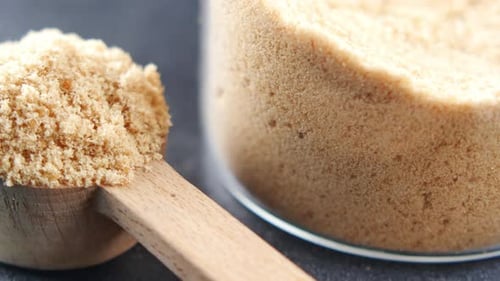 Wooden Spoon with Brown Sugar Close Up
