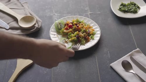 Delicious Salad with Kiwi Slices on a Table
