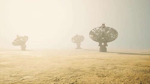 Modern Radio Telescopes in Hazy Desert Landscape
