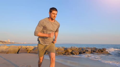 Athletic Man Exercising At The Beach