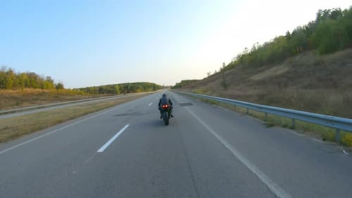 Follow to Motorcyclist Riding on Modern Sport Motorbike at Highway