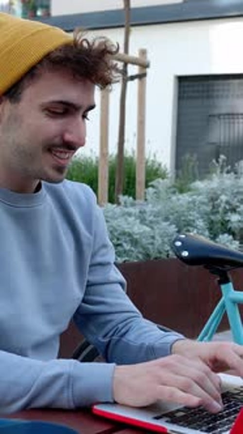 Young Student Man Working on Laptop Sitting on Table at Campus College