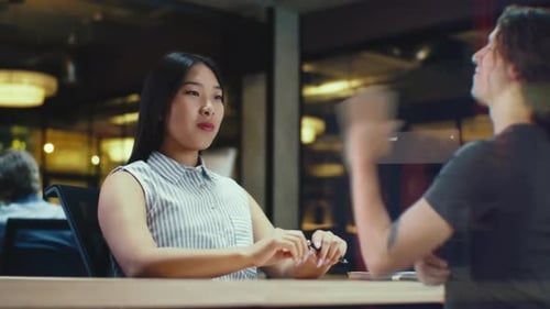 Asian Girl Receives Call Via Abstract Futuristic Screen Hologram Starts Talking