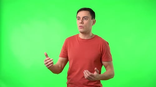 Man puts on face mask on green screen