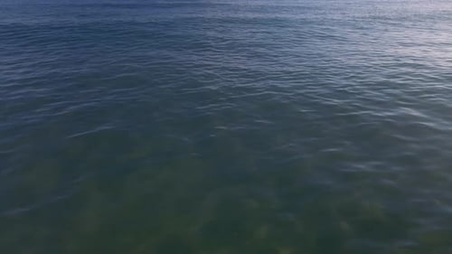 Calm ocean waves on a clear day