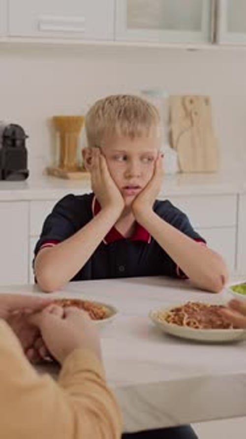 Frustrated Teenager Suffering from Parents Quarrel at Lunch