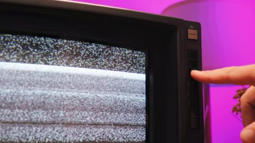Vintage Television Displaying Static With Channel Buttons