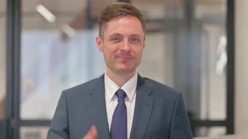 Man in Suit Giving Thumbs Up