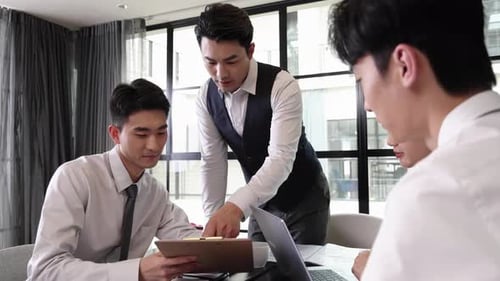 Focused Business Team Meeting in Bright Modern Office