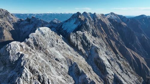 Aerial view of snow capped mountain peaks, Italy.
