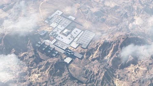 Nuclear facility hidden in the desert with mountains, Aerial