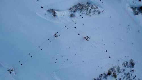 Funicular Chairlift timelapse lifts skiers and snowboarders at a ski resort