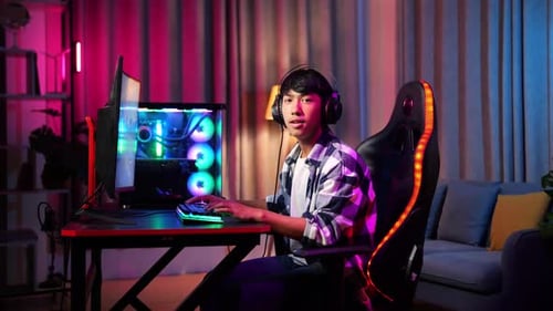 Young Adult Gaming at Home in Colorful Room