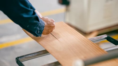 Carpenter Repairing a Cracked Wooden Plank