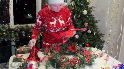 Woman Making a Festive Christmas Wreath