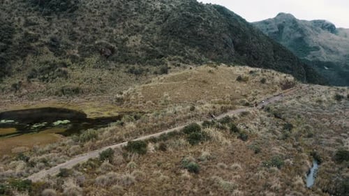 Hikers Walking In The Trail At Cayambe Coca Ecological Reserve In Napo, Ecuador. - aerial