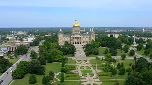 Des moines Iowa state capitol building aerial flyby on a bright sunny day