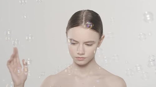 Woman Playing with Soap Bubbles
