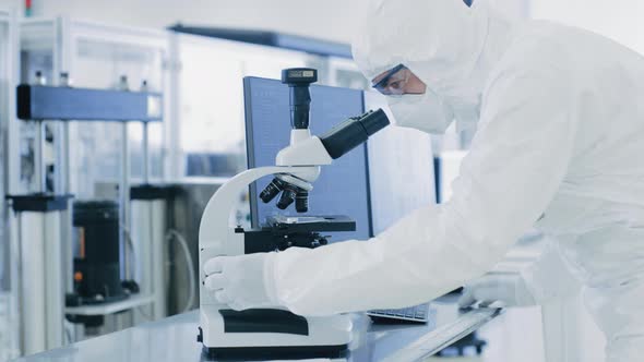 In Laboratory Scientist in Protective Clothes Doing Research Uses ...