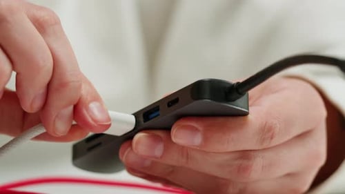Plugging Cables Into a USB Hub Close Up