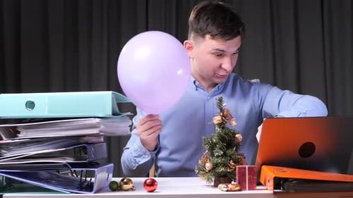 Office Worker Waiting for Christmas Holidays Holding Balloon and Countdown