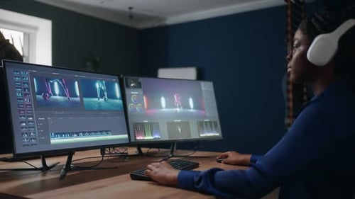Woman Editing Video in Modern Office Workplace