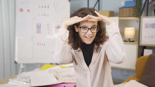 Woman Dances Expressively in Front of Whiteboard