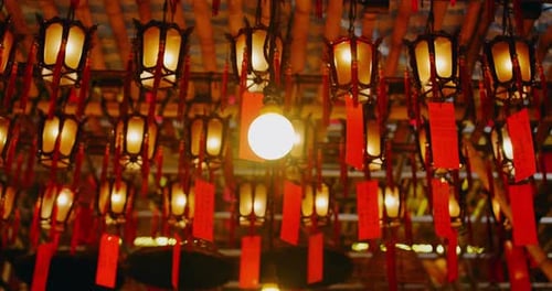 Close Up of Lights and Lanterns Burning Buddhist Temple Religious Mysterious Beautiful