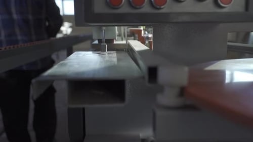 Edge banding machine in carpentry workshop. Slow Motion.