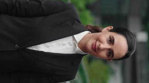 Vertical Video Confident Joy Female Businessperson Standing Posing in Office to the Camera