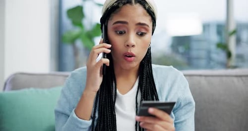 Woman Talking on Phone Holding Credit Card