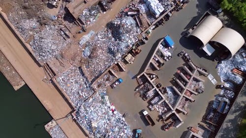 Scrap metal recycling center sorting waste. Amazing aerial view flight drone