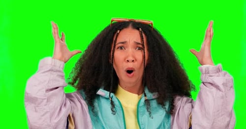 Surprise, mind blown and face of a woman on a green screen isolated on a studio background