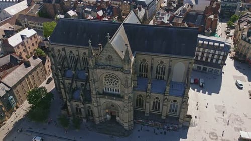 Basilica Saint-Aubin in Place Sainte Anne square, Rennes in France. Aerial backward