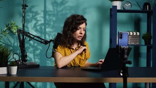 Woman Chatting with Subscribers Presenting Information on Notebook Device