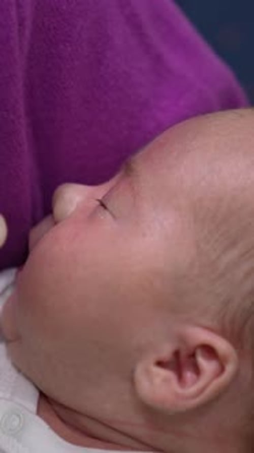 Adorable Infant Being Bottle Fed Close Up