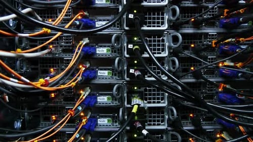 Illuminated server farm with data cables and blinking lights