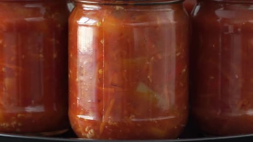 Canned Tomatoes Vegetables in Jars Close-Up