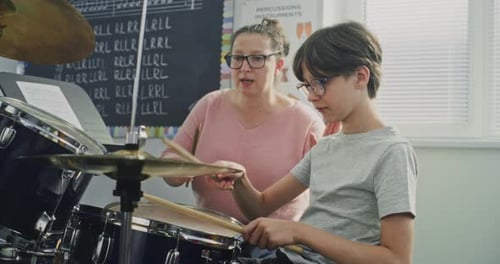 Primary School Boy Practicing Drums in Modern Music Class Dreaming to Become Drummer