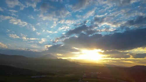 Majestic Sunrise Over Lush Landscape From Above