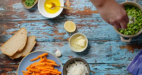 Adding Salt to Fresh Green Beans on Table