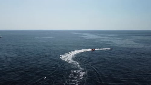 Jet Ski Pulling Raft on Open Ocean Adventure